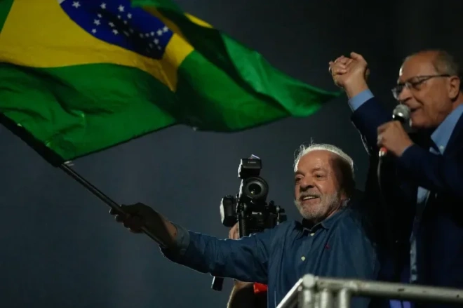 [Natacha Pisarenko/AP Photo] Luiz Inacio Lula da Silva and running mate Geraldo Alckmin address supporters